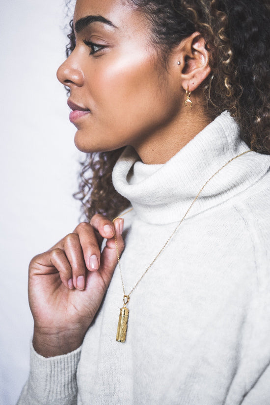 Woman wearing Mini Crescent Hooped Stud earring