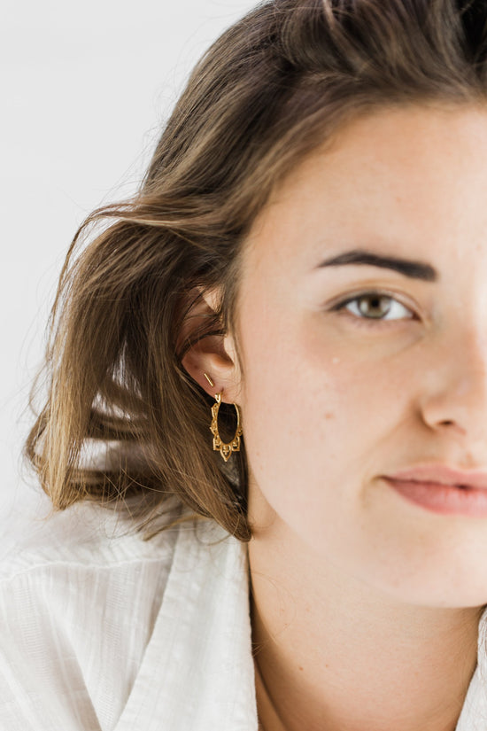 Close up of woman wearing Small Boho Hoop earring