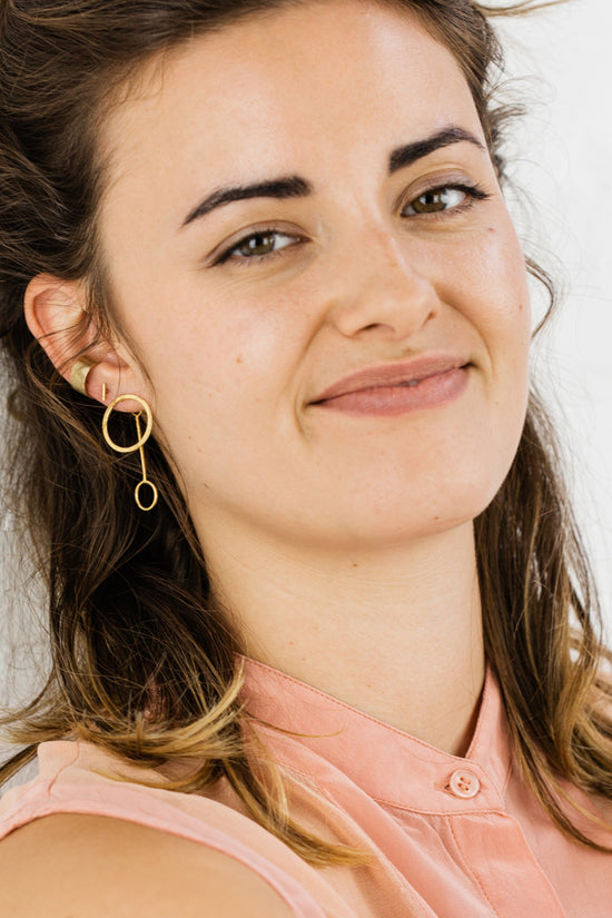 Close up of woman wearing Bold Cuff earring