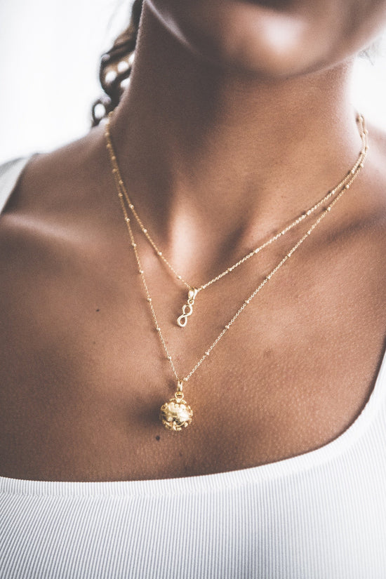 Close up of woman wearing Eternal Love Pendant Necklace