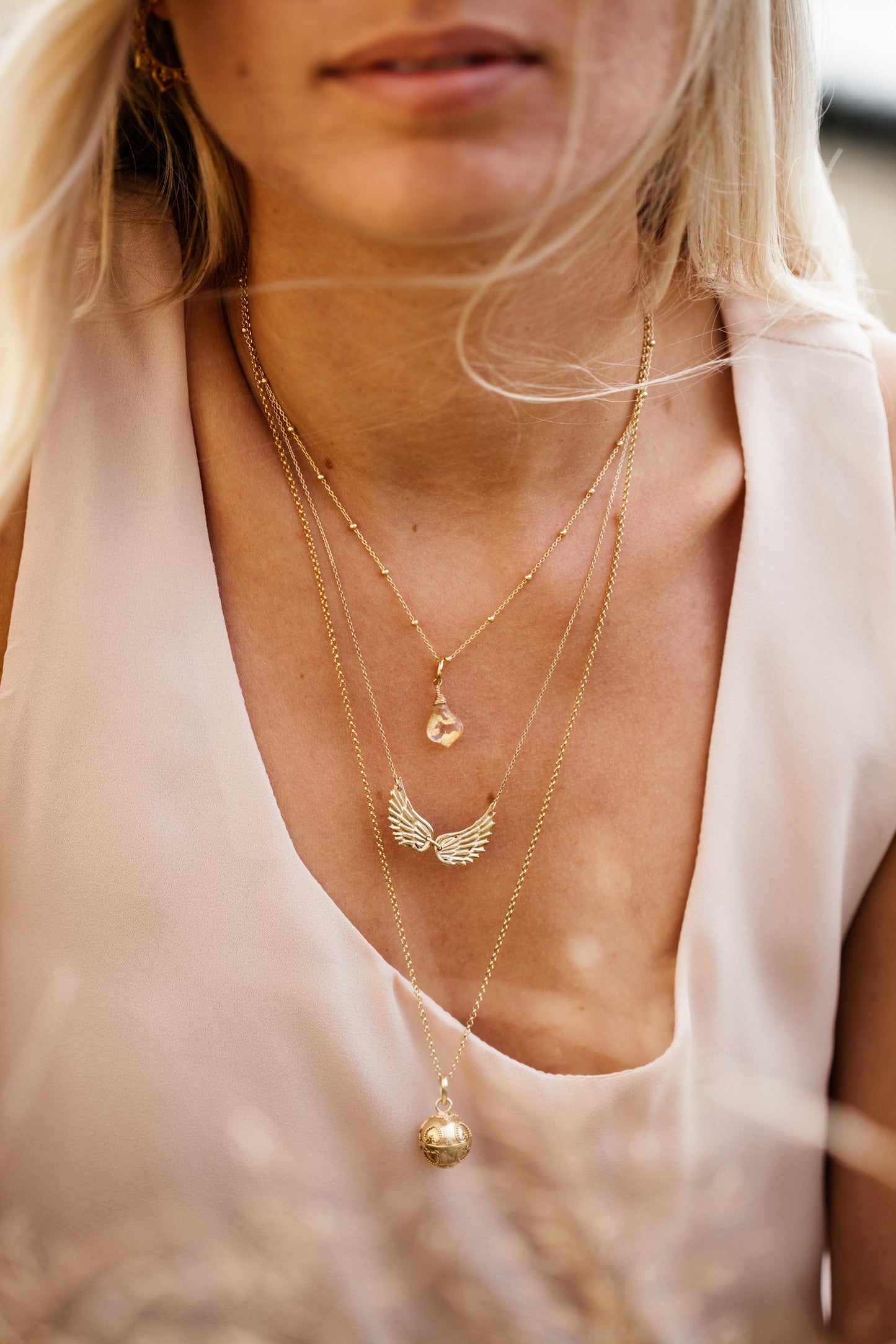 Woman wearing Double Angel Wing Necklace