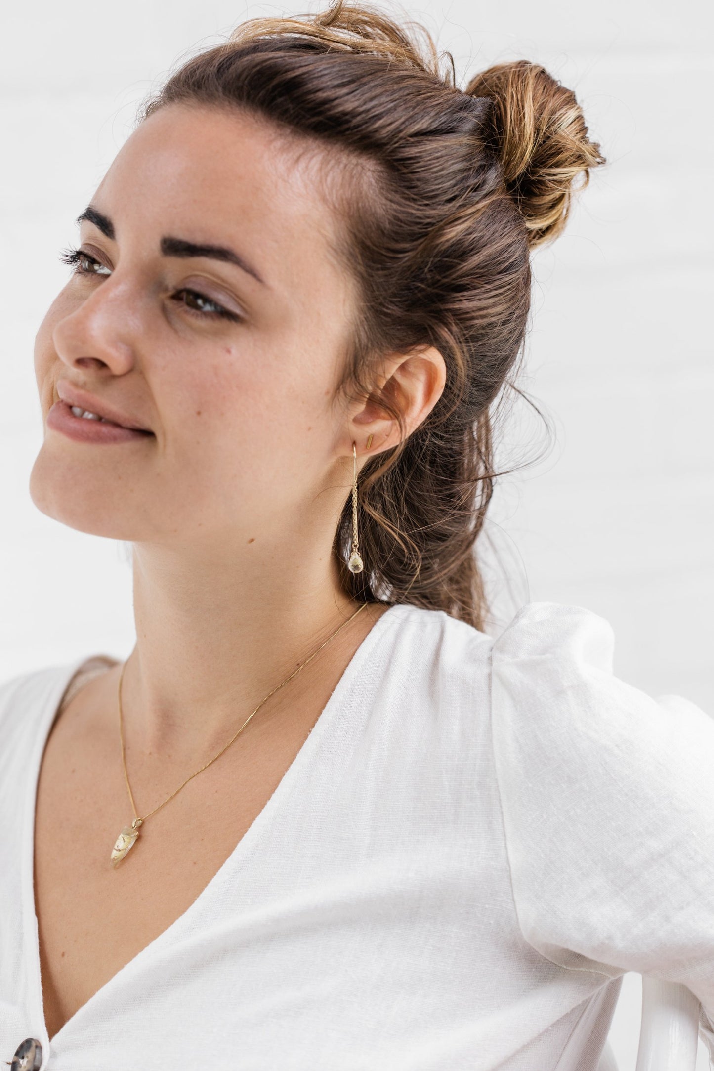 Woman wearing Guardian Clear Quartz Threader earring