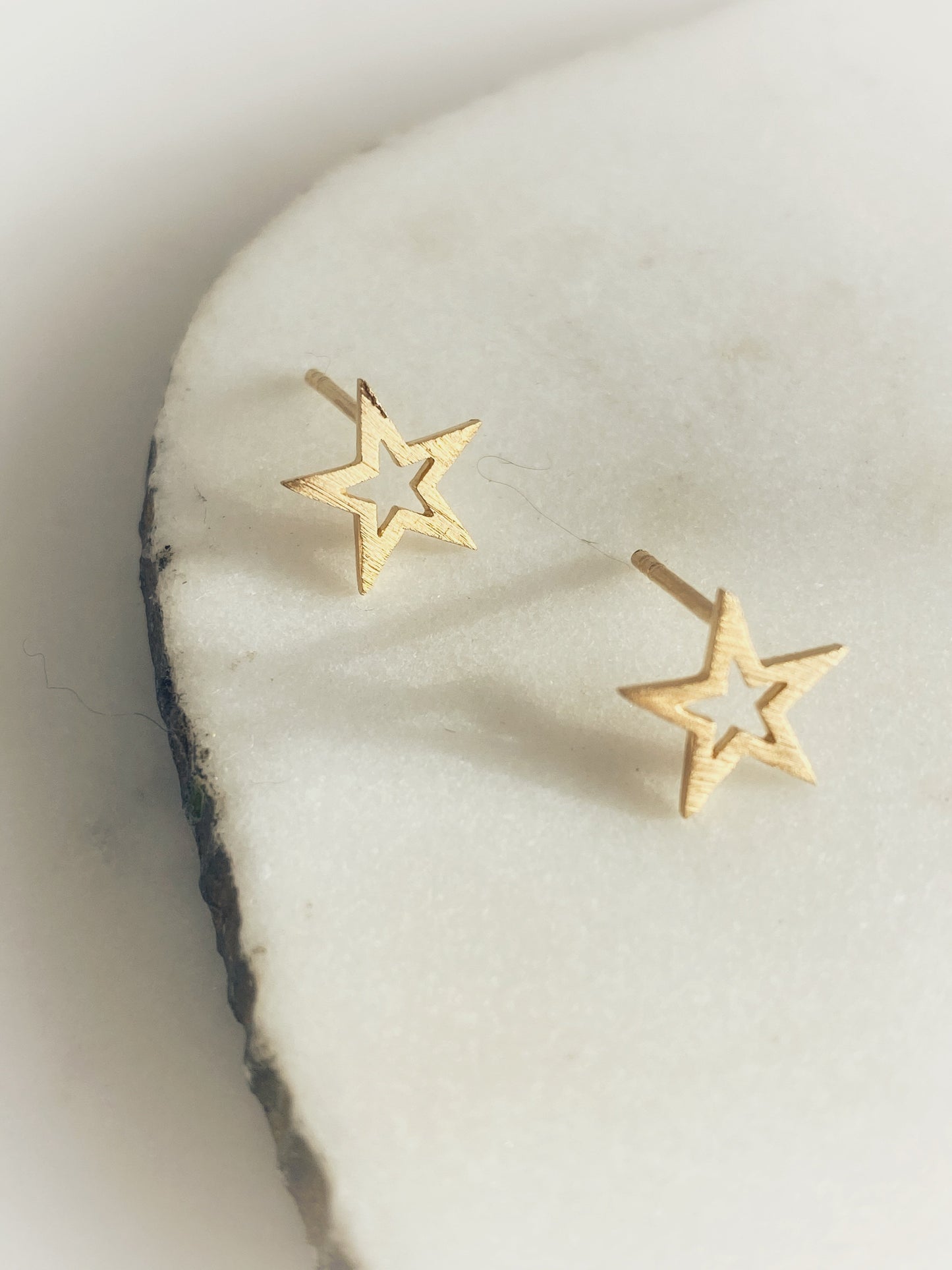 Close up of Small Star Stud earrings