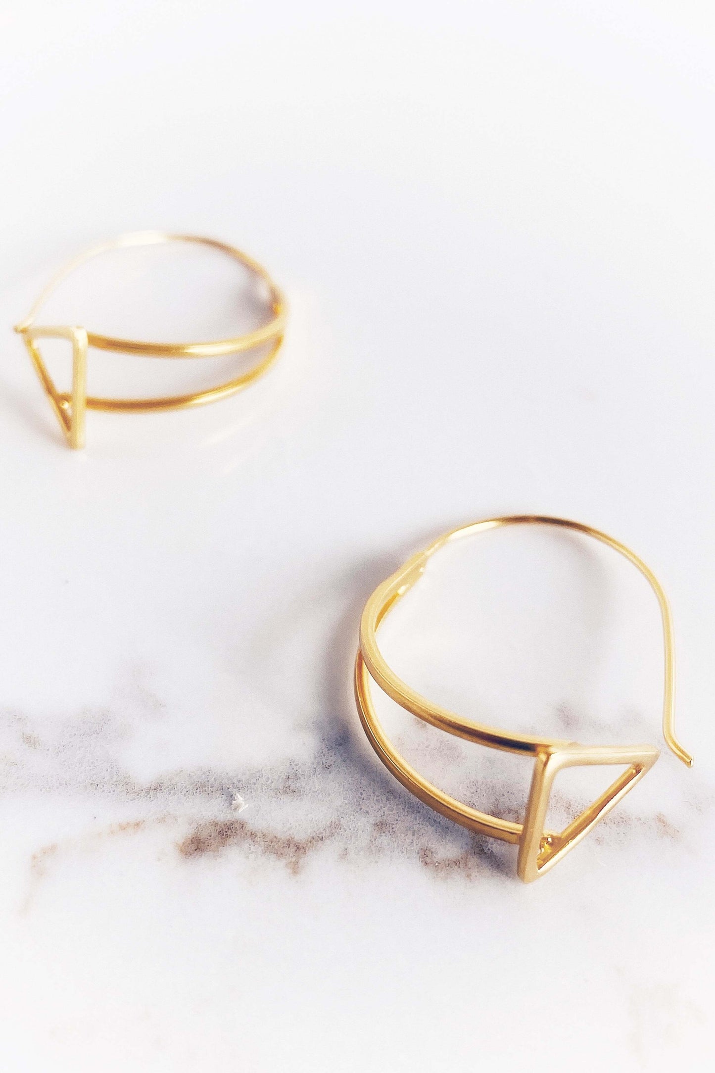 Close up of Jaqueline Triangle Drop Hoop Earrings