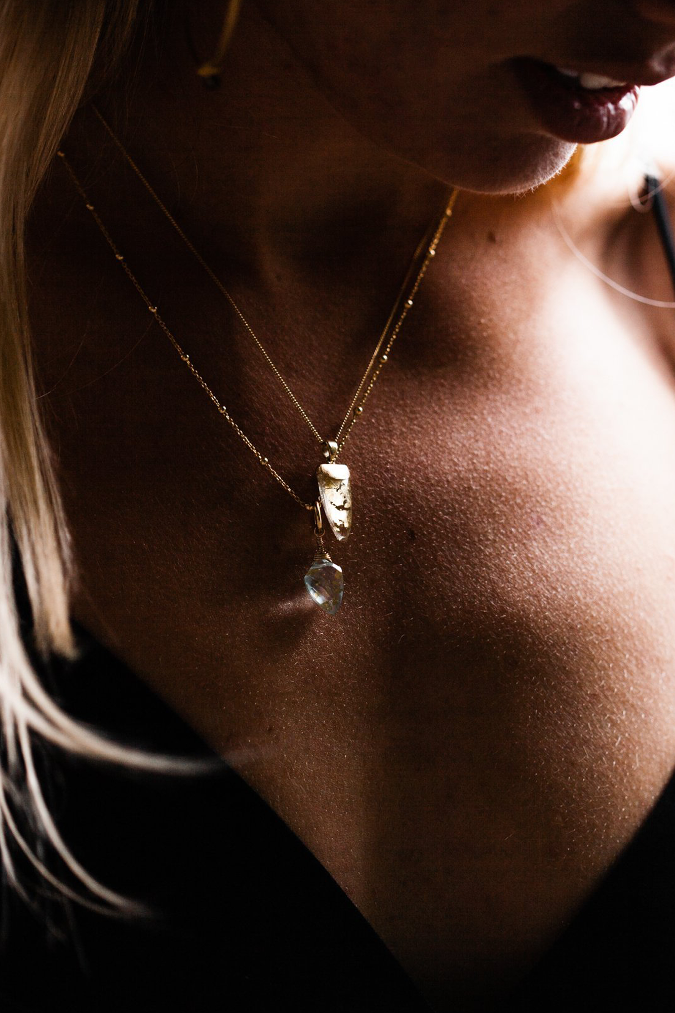 Woman wearing Guardian Clear Quartz Teardrop Pendant Necklace