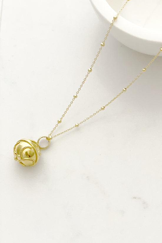Close up of Twirl Harmony Ball necklace