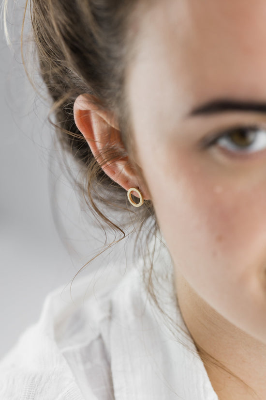 Close up of woman wearing Small Circle Stud earring