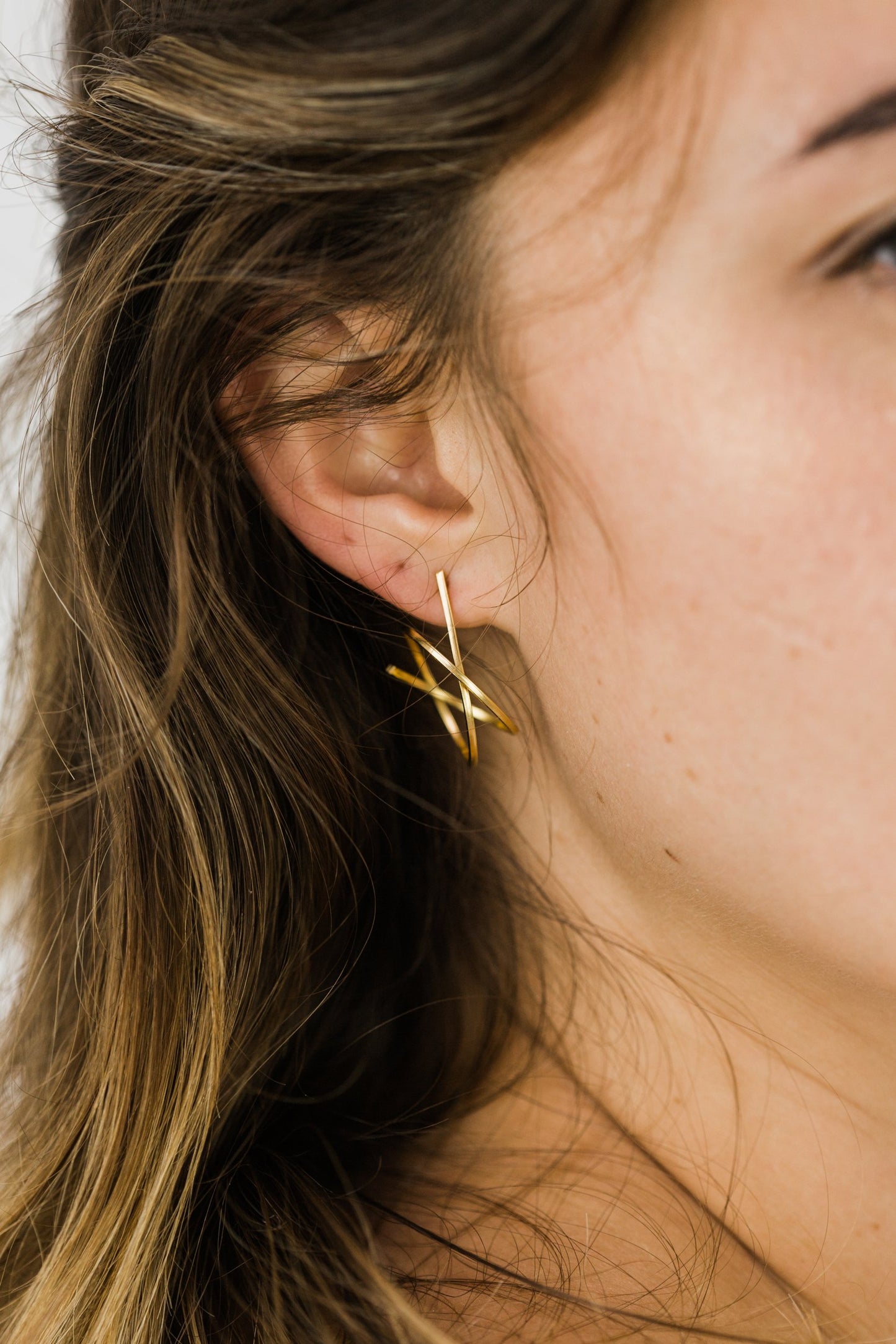 Close up of woman wearing Valentina Galaxy Hooped Stud earring